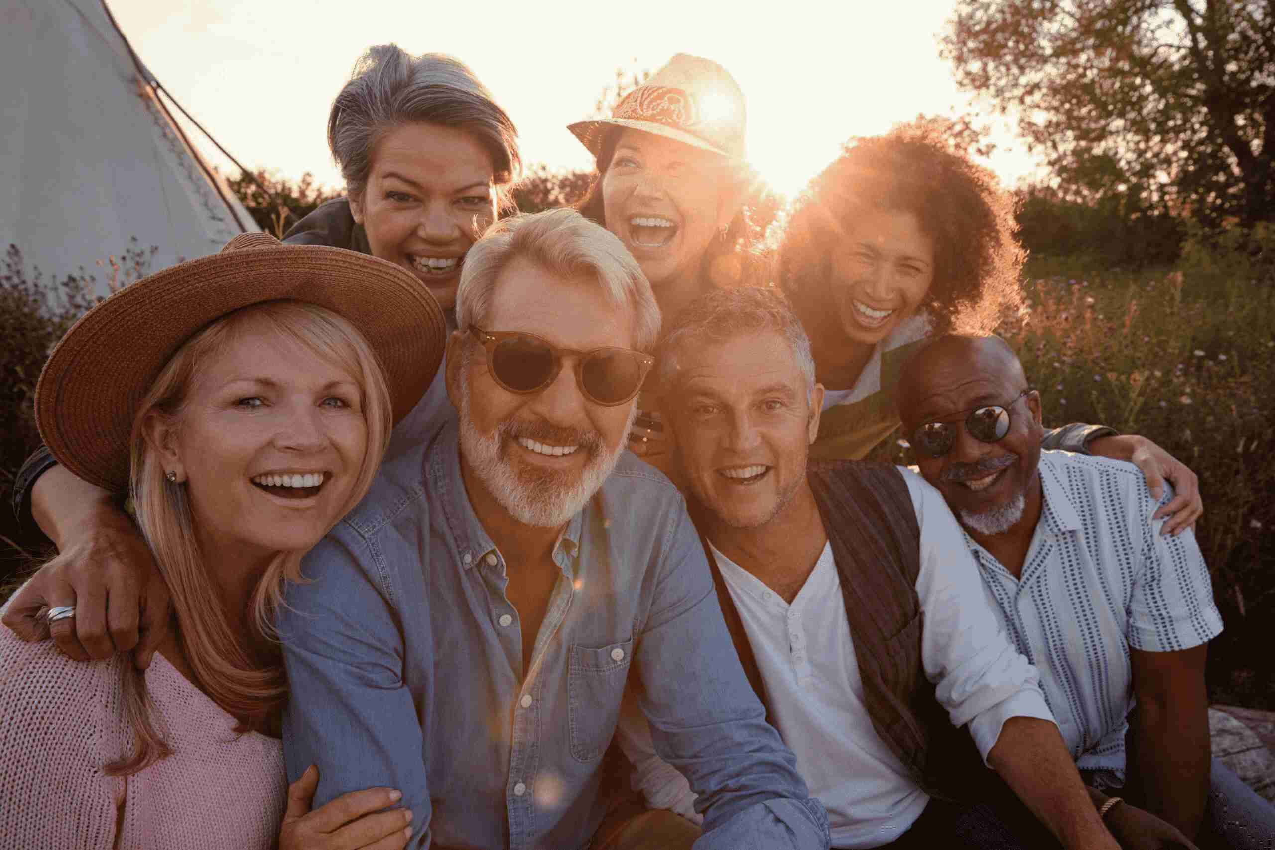 Group of diverse adults smiling together outdoors